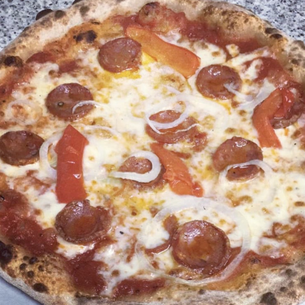 leña. Cómo hacemos nuestras pizzas - Restaurante italiano y pizzería en Granollers